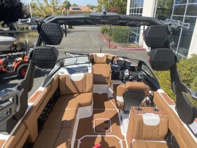 Slide: The Image of Interior of 2026 Malibu Wakesetter 25 LSV with brown seating. - 9