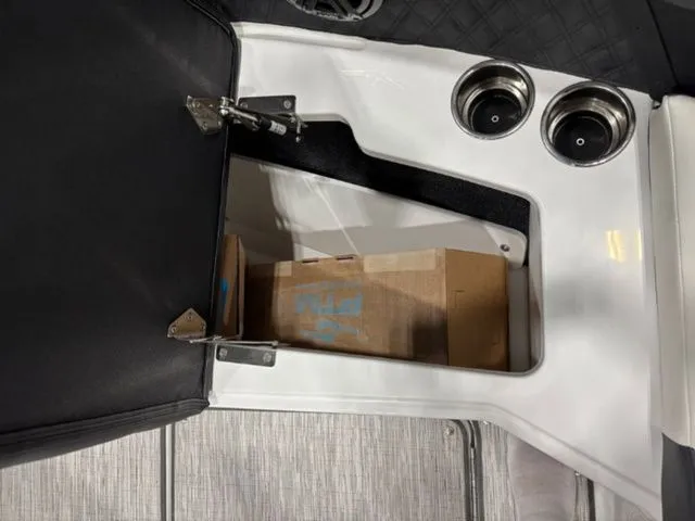 Slide: The Image of Interior of 2026 Cobalt R6 with storage compartment and cup holders. - 8