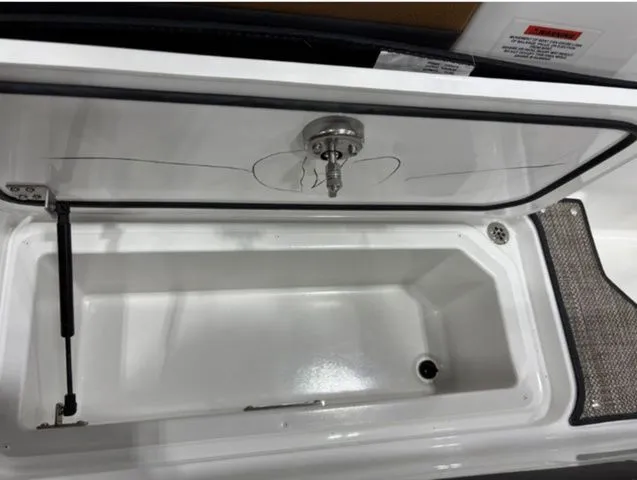 Slide: The Image of Open storage compartment in 2026 Cobalt R4 boat. - 13