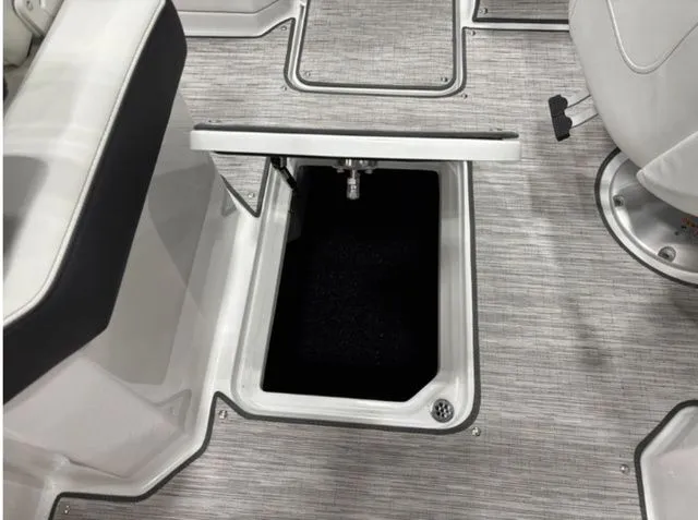 Slide: The Image of 2026 Cobalt R6 boat with open storage compartment lid. - 16