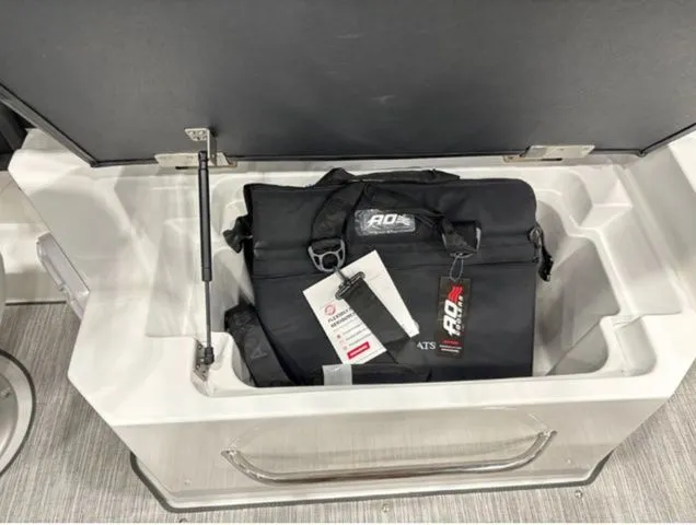 Slide: The Image of Storage compartment in Cobalt R6 boat with black bag, 2026 model. - 18