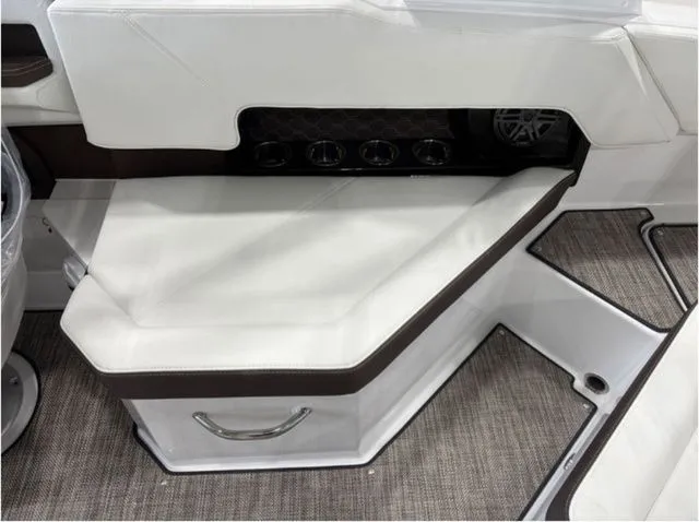 Slide: The Image of Interior of 2026 Cobalt R4 Surf with white seating and speaker. - 13