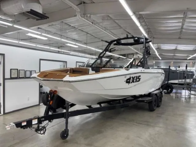 Slide: The Image of 2026 Axis Wake Research A225 boat in a warehouse. - 4