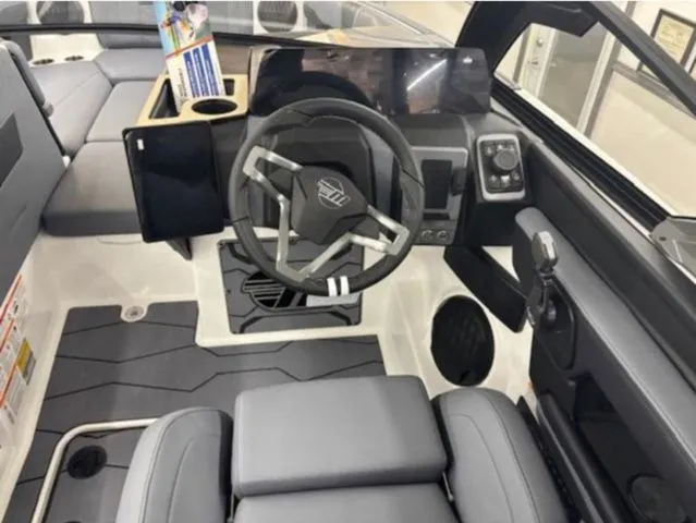 Slide: The Image of Interior of 2026 Malibu Wakesetter 23 MXZ with modern helm. - 10