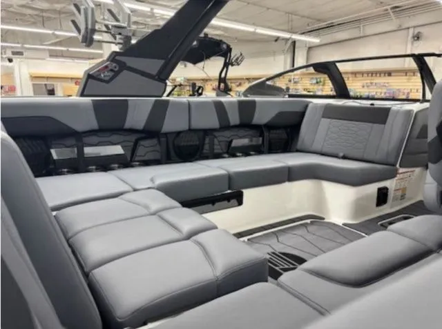 Slide: The Image of Interior of 2026 Malibu Wakesetter 23 MXZ with gray upholstery. - 11