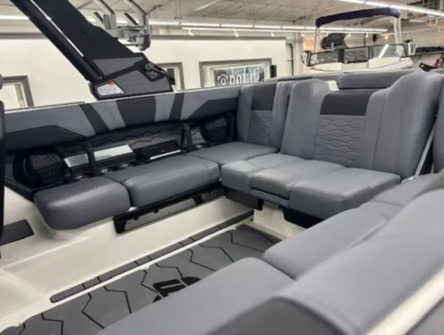 Slide: The Image of Interior of 2026 Malibu Wakesetter 23 MXZ with gray upholstery. - 12