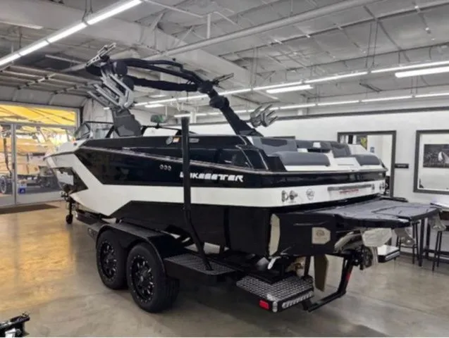 Slide: The Image of 2026 Malibu Wakesetter 23 MXZ boat in a workshop. - 3