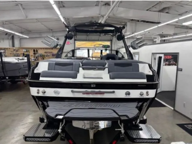 Slide: The Image of 2026 Malibu Wakesetter 23 MXZ boat in showroom. - 5