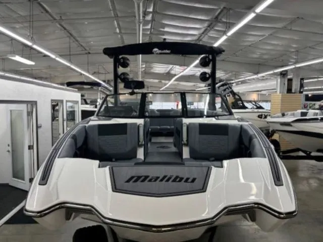 Slide: The Image of 2026 Malibu Wakesetter 23 MXZ boat in showroom. - 6