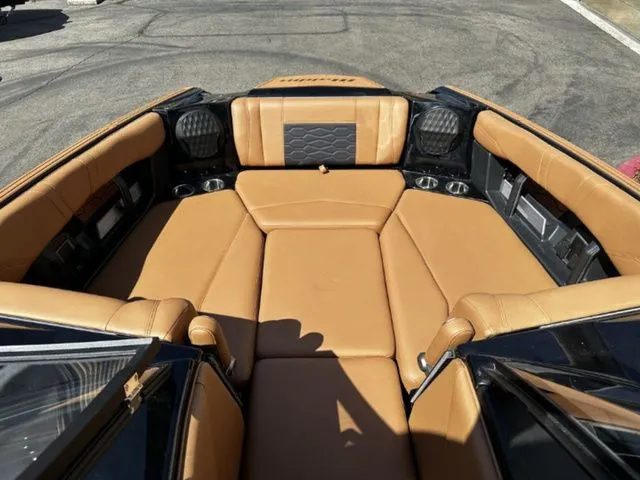 Slide: The Image of Interior of 2026 Malibu Wakesetter 23 MXZ with brown leather seats. - 10