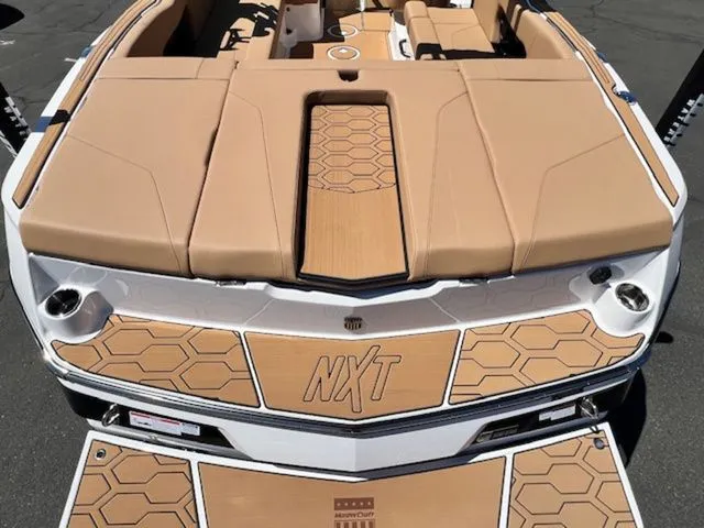 Slide: The Image of Rear view of 2026 MasterCraft NXT22 boat with stylish design. - 10
