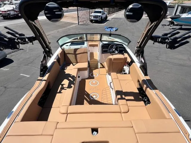 Slide: The Image of Interior view of 2026 MasterCraft NXT22 boat with beige seating. - 11