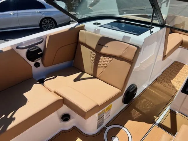 Slide: The Image of Interior of a 2026 MasterCraft NXT22 boat with beige seating. - 14