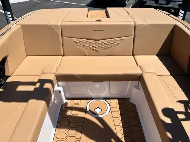 Slide: The Image of Interior of a 2026 MasterCraft NXT22 boat with beige upholstery. - 16