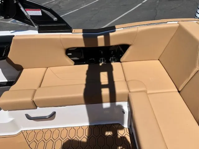 Slide: The Image of Interior of 2026 MasterCraft NXT22 with beige upholstery. - 17