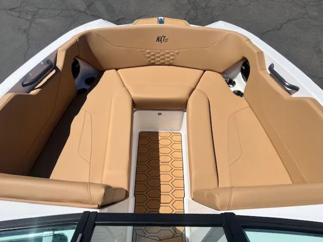 Slide: The Image of Interior of 2026 MasterCraft NXT22 with beige seating. - 18