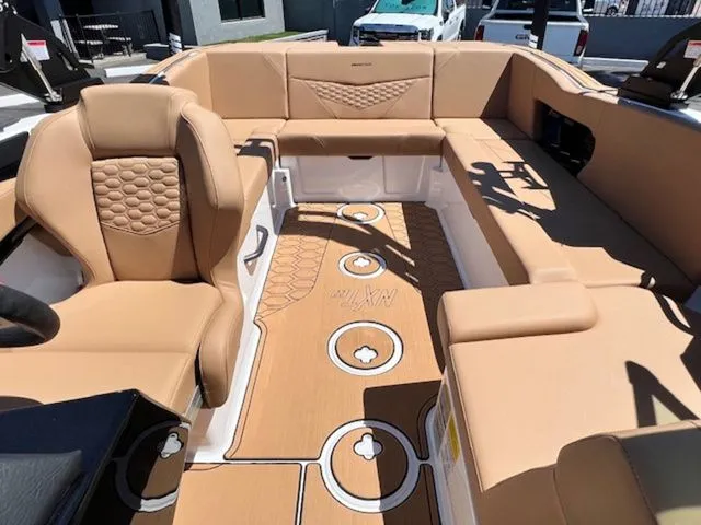 Slide: The Image of Interior of 2026 MasterCraft NXT22 with luxurious leather seating. - 19