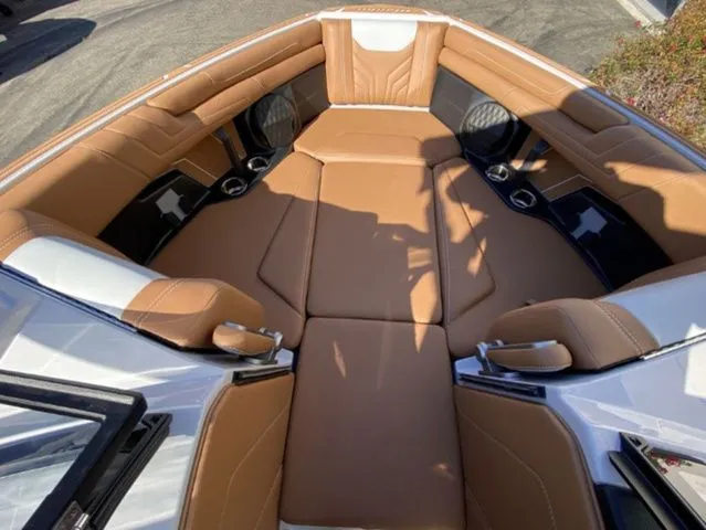 Slide: The Image of Interior of 2026 Malibu Wakesetter 25 LSV with brown leather seating. - 11