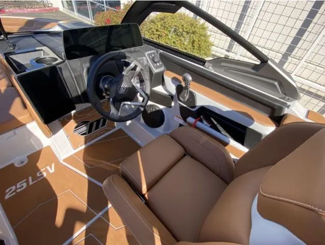 Slide: The Image of Interior of 2026 Malibu Wakesetter 25 LSV with brown seats. - 12