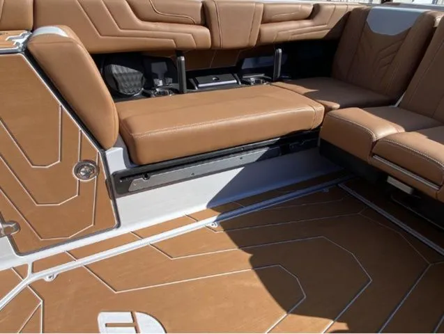 Slide: The Image of Interior of 2026 Malibu Wakesetter 25 LSV with brown leather seating. - 15
