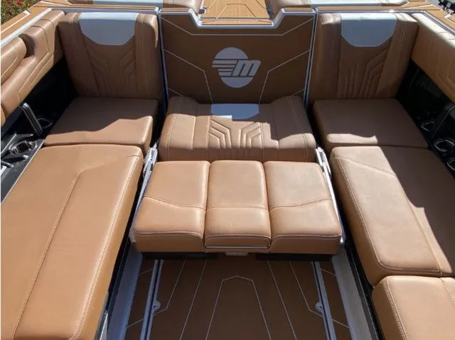 Slide: The Image of Interior of 2026 Malibu Wakesetter 25 LSV with brown leather seating. - 17