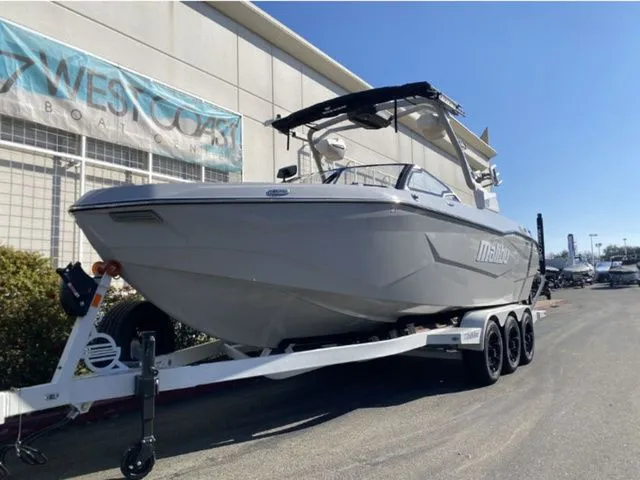 Slide: The Image of 2026 Malibu Wakesetter 25 LSV on trailer outside a building. - 4