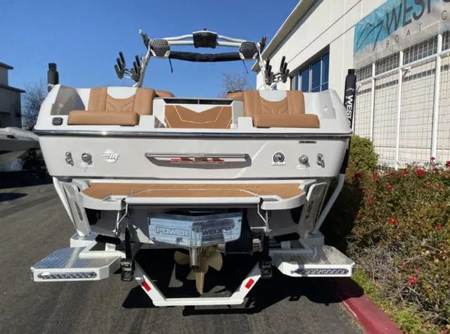 Slide: The Image of Rear view of 2026 Malibu Wakesetter 25 LSV boat in parking lot. - 7