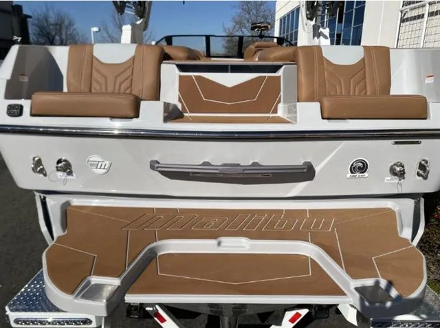 Slide: The Image of Rear view of 2026 Malibu Wakesetter 25 LSV with brown seating. - 9