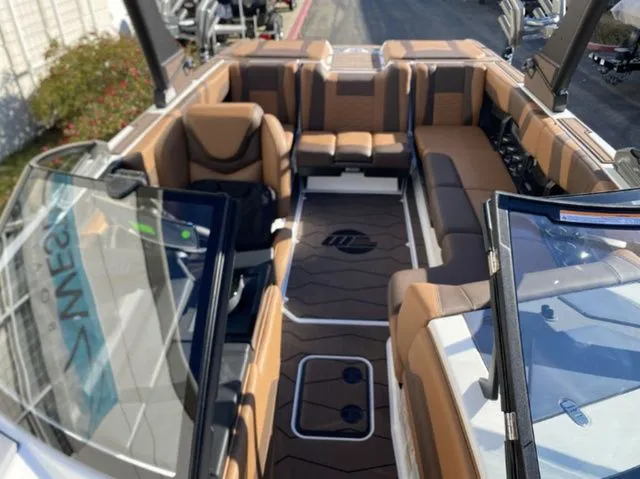 Slide: The Image of Interior of 2026 Malibu Wakesetter 23 MXZ with luxurious seating. - 10