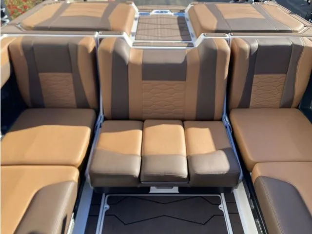 Slide: The Image of Interior of 2026 Malibu Wakesetter 23 MXZ with brown leather seats. - 13
