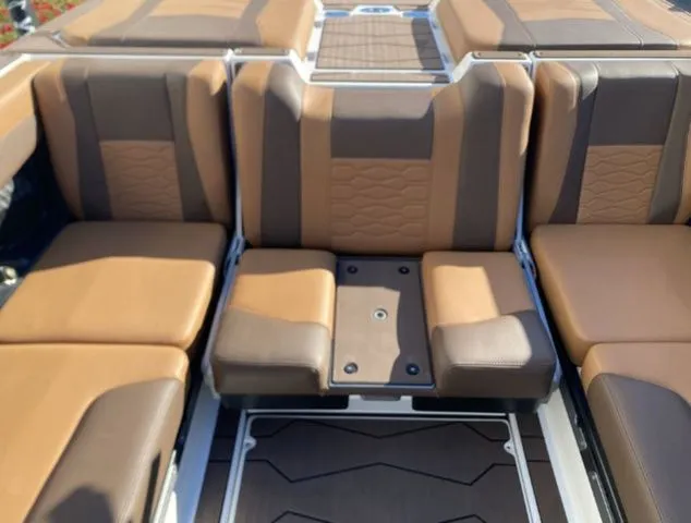 Slide: The Image of 2026 Malibu Wakesetter 23 MXZ interior with brown seating. - 14