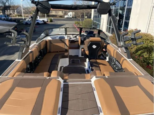 Slide: The Image of Interior of 2026 Malibu Wakesetter 23 MXZ with luxurious seating. - 18