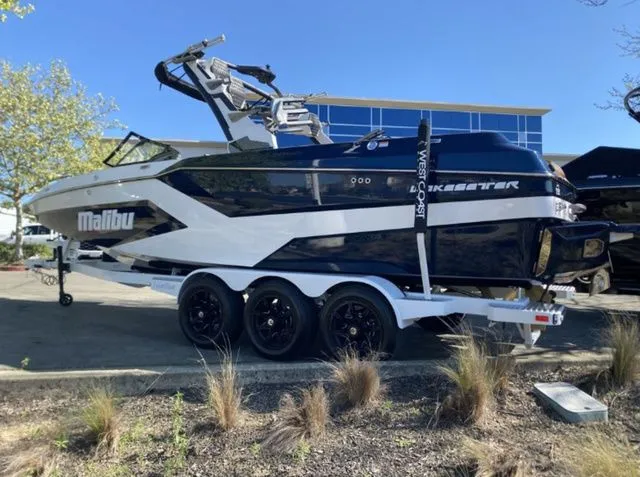 Slide: The Image of 2026 Malibu Wakesetter 24 MXZ boat on trailer, side view. - 10