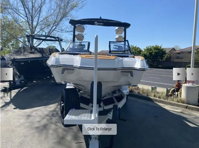Slide: The Image of 2026 Malibu Wakesetter 24 MXZ parked on a trailer. - 3
