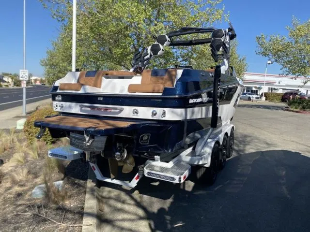 Slide: The Image of 2026 Malibu Wakesetter 24 MXZ boat parked on trailer. - 4