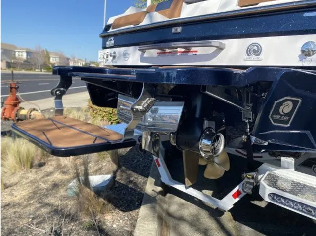 Slide: The Image of Rear view of 2026 Malibu Wakesetter 24 MXZ with propeller and platform. - 5