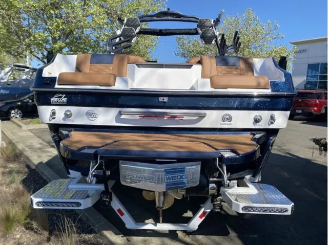 Slide: The Image of Rear view of 2026 Malibu Wakesetter 24 MXZ with brown seats. - 6
