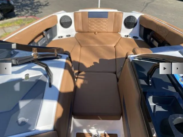Slide: The Image of Interior of 2026 Malibu Wakesetter 24 MXZ with brown seating. - 8