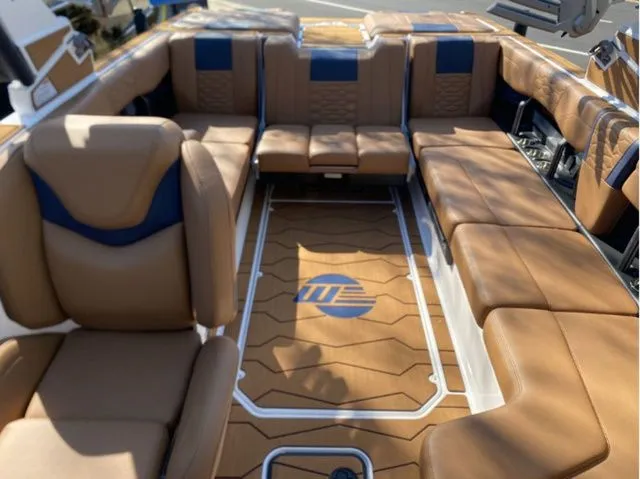 Slide: The Image of 2026 Malibu Wakesetter 24 MXZ interior with luxurious seating. - 9