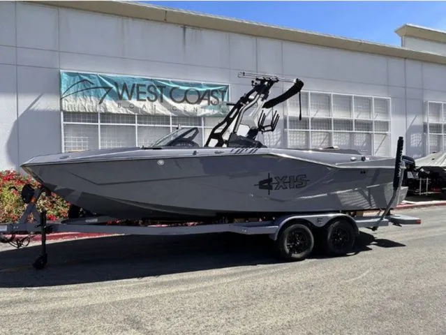 The Image of 2026 Axis Wake Research T235 boat in front of West Coast building. - 1