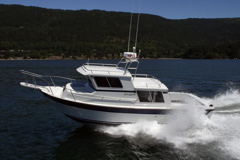 The Image of 2026 Sea N Sport Alaskan Pilot 2600 cruising on a scenic lake. - 1