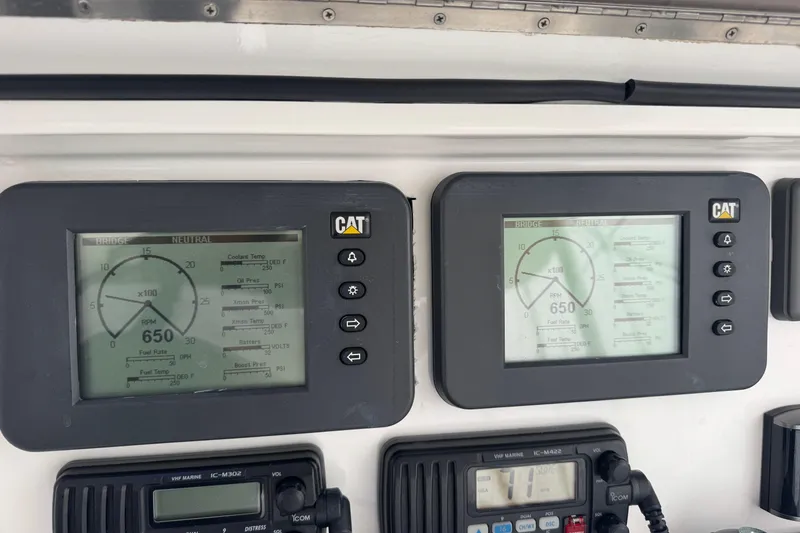 Slide: The Image of Control panel of a 2009 Ocean Yachts 42 Super Sport with CAT engine displays. - 15
