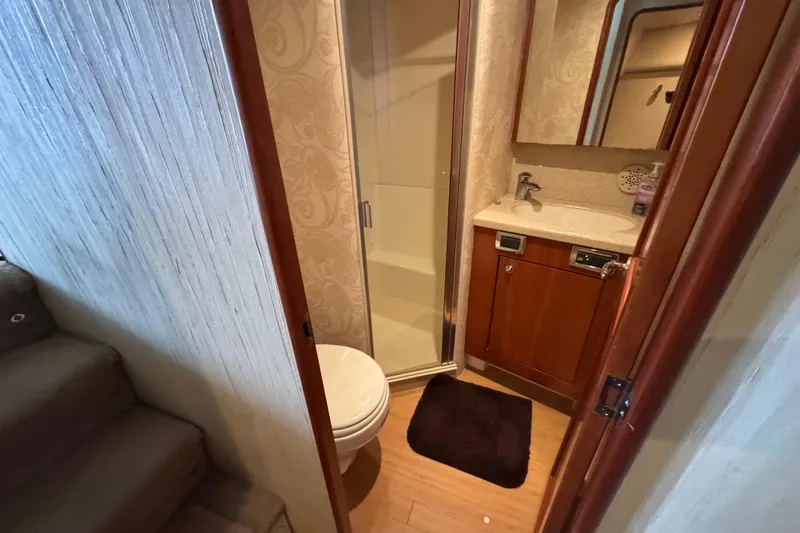 Slide: The Image of Bathroom interior of 2009 Ocean Yachts 42 Super Sport with shower and wooden cabinetry. - 7