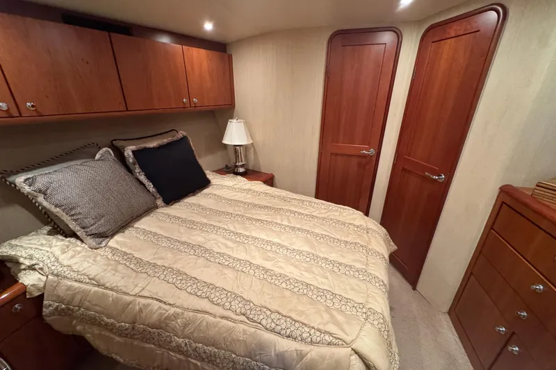 Slide: The Image of Luxurious bedroom interior of 2009 Ocean Yachts 42 Super Sport with elegant wood finishes. - 9