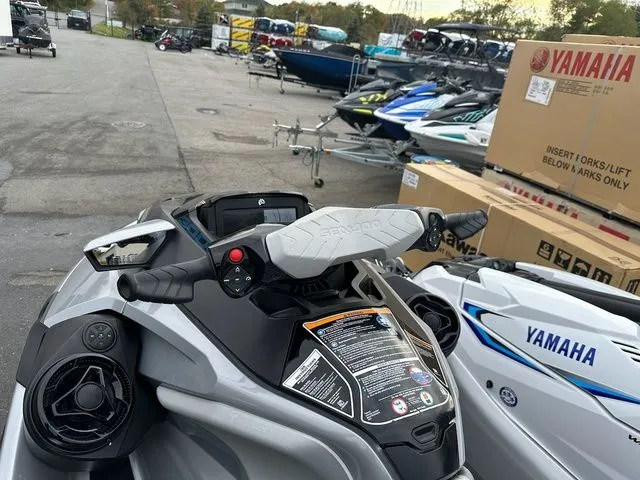 Slide: The Image of 2021 Sea-Doo GTX jet ski parked among other watercraft. - 11
