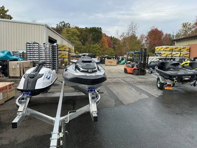 Slide: The Image of 2021 Sea-Doo GTX jet skis on trailers in a storage area. - 4