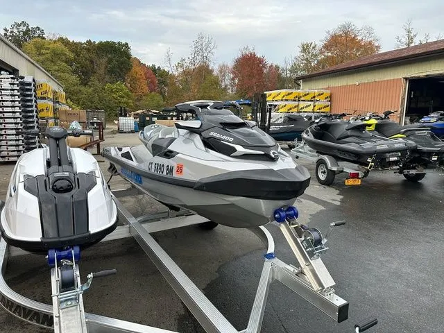 Slide: The Image of 2021 Sea-Doo GTX jet ski parked on trailer outdoors. - 5