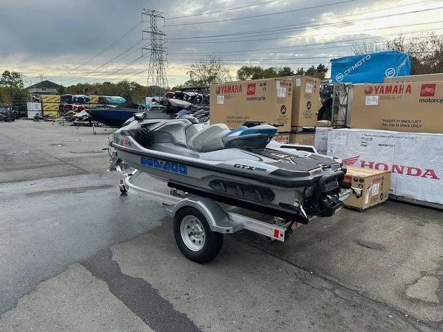 Slide: The Image of 2021 Sea-Doo GTX jet ski parked on a trailer outdoors. - 8