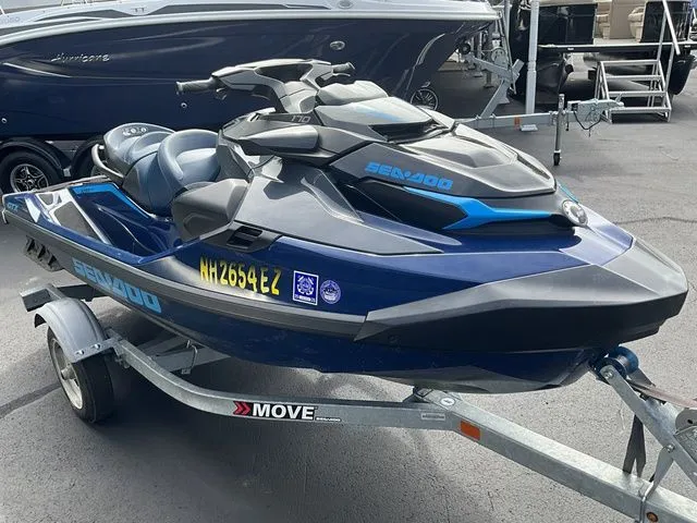 Slide: The Image of 2024 Sea-Doo GTX jet ski on trailer, blue and black, side view. - 3
