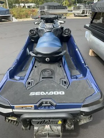 Slide: The Image of 2024 Sea-Doo GTX jet ski in blue on a parking lot. - 4